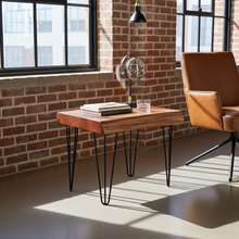 Load image into Gallery viewer, Wooden side table with books and a glass on a brick wall background