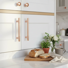 Load image into Gallery viewer, Kitchen counter with bread, flowers, and a mug on a white cabinet background