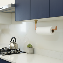 Load image into Gallery viewer, Modern kitchen with blue cabinets, white countertops, and a gas stove.