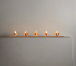 Handmade copper pipe tea light holder or dining table centre piece holding five tea lights.