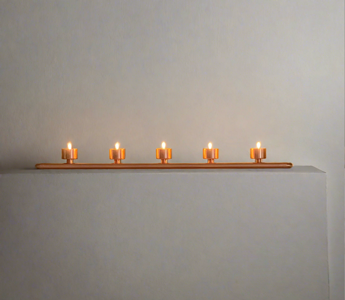 Handmade copper pipe tea light holder or dining table centre piece holding five tea lights.