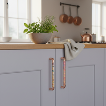 Load image into Gallery viewer, Handmade copper pull handles with rainbow effect installed on kitchen cabinets