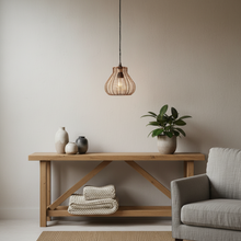 Load image into Gallery viewer, Modern living room with wooden console table, gray sofa, and decorative items.