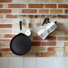 Load image into Gallery viewer, chrome kitchen utensil rail on a distressed brick wall