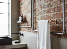 Load image into Gallery viewer, Copper and brass towel rail on a brick wall industrial themed bathroom